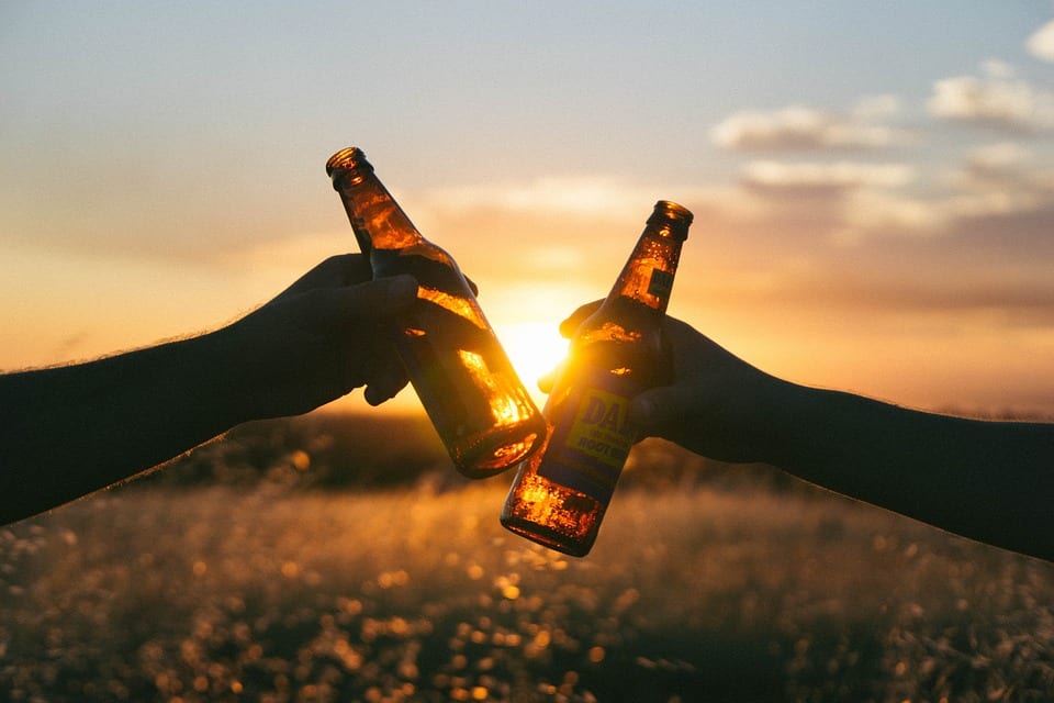 Friends raising glasses, Australia's drinking culture