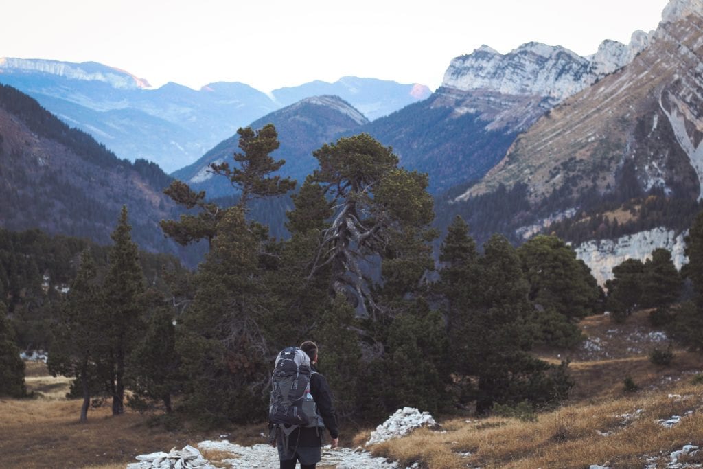 Hiker carrying a camping backpack